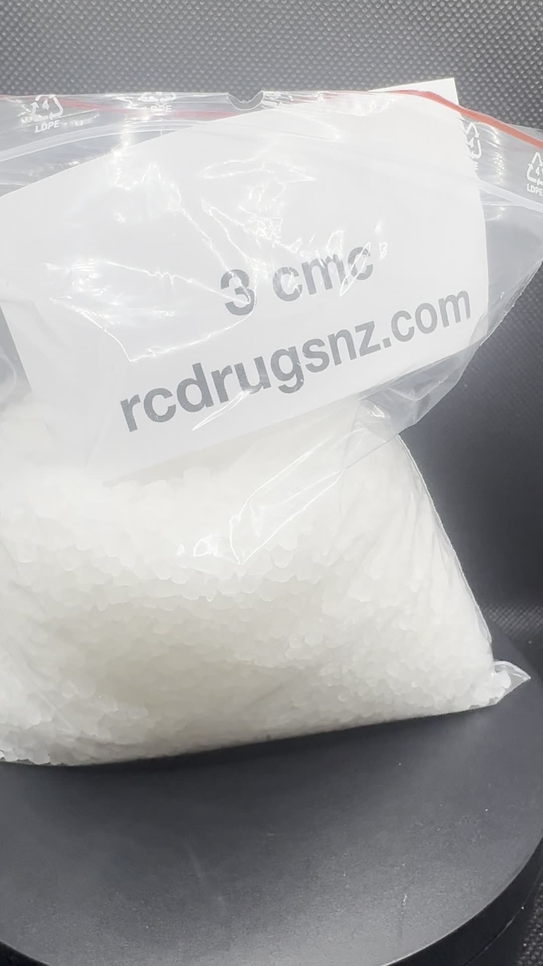 3-CMC crystals with a batch card.